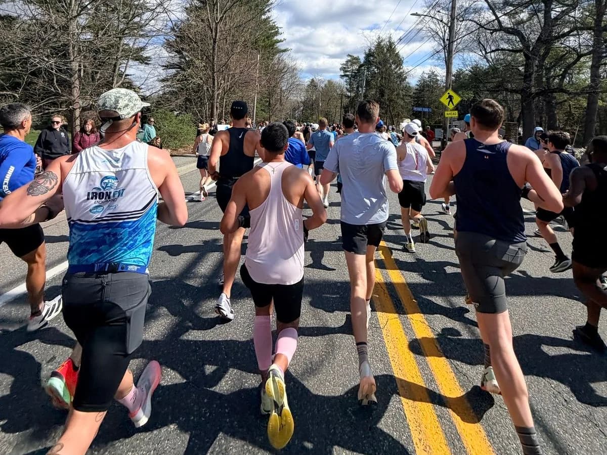 Runners on the road at mile one of the Boston Marathon