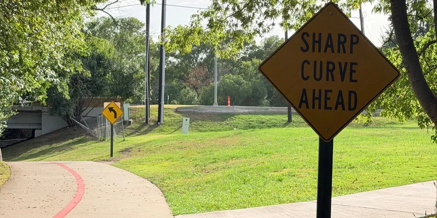 A sharp-curve sign where the CentrePort Trail bends
